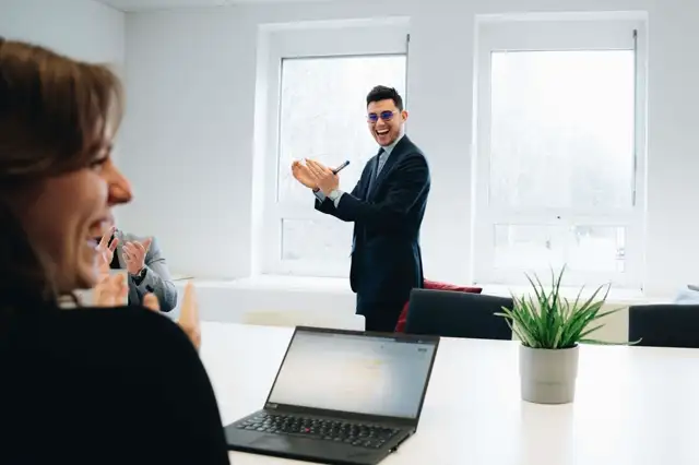 A team member giving a presentation during a team meeting